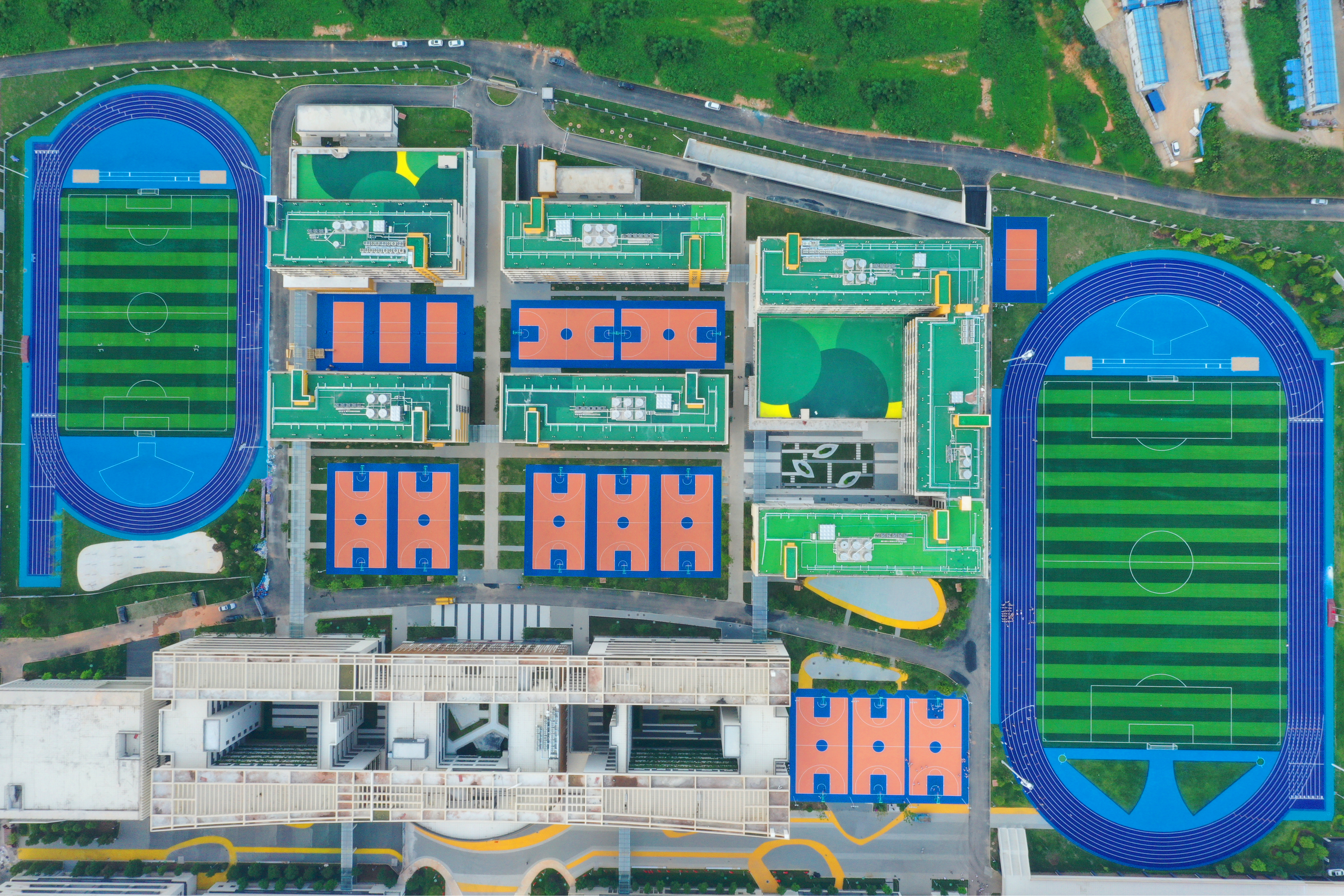 Aerial view of air permeable running track surface for school sports field