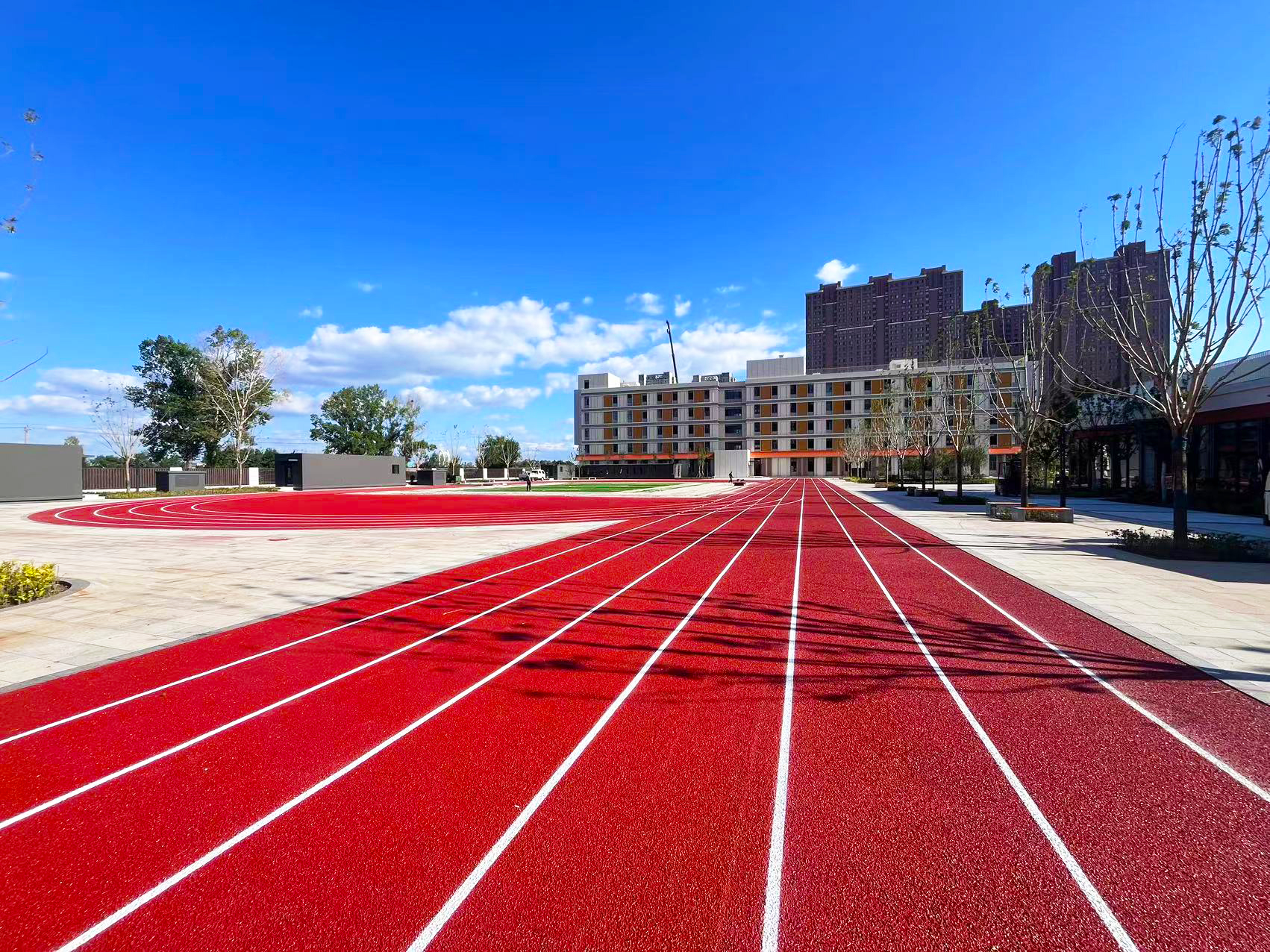 Hybrid athletic running track surface for stadium and school sports fields